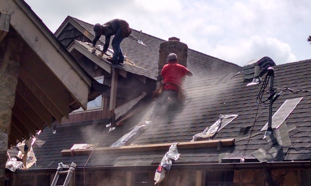 Roofers work on elements that add to the cost of a roof.