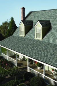 Light colored Owens Corning shingles on a roof.