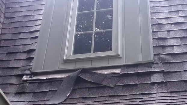 putting new shingles over old ones